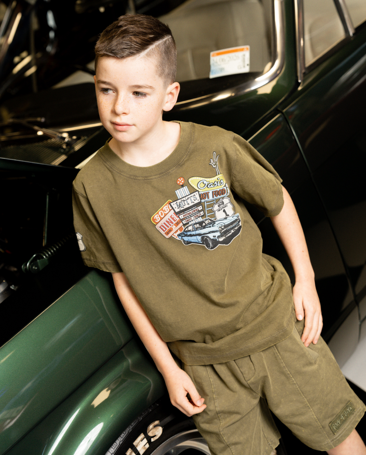 Band of Boys khaki tee with Route 66 type graphics and badge on arm