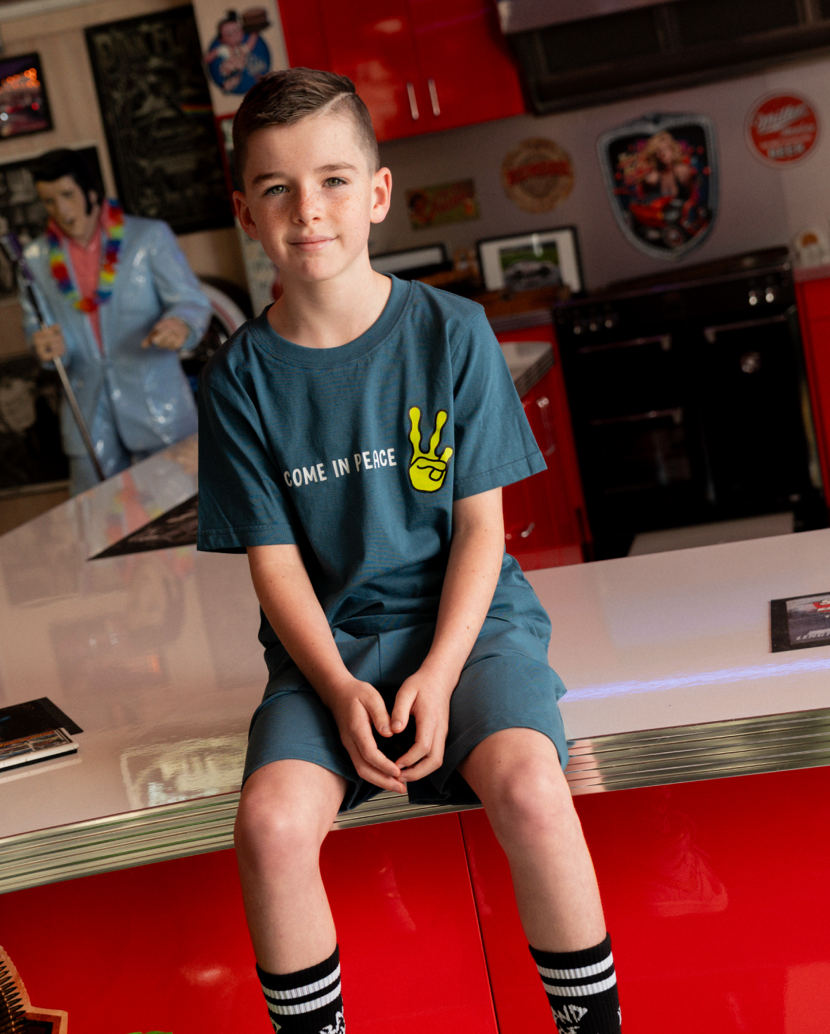 Blue Band of Boys scoop hem tee shirt with alien graphic and peace fingers graphic