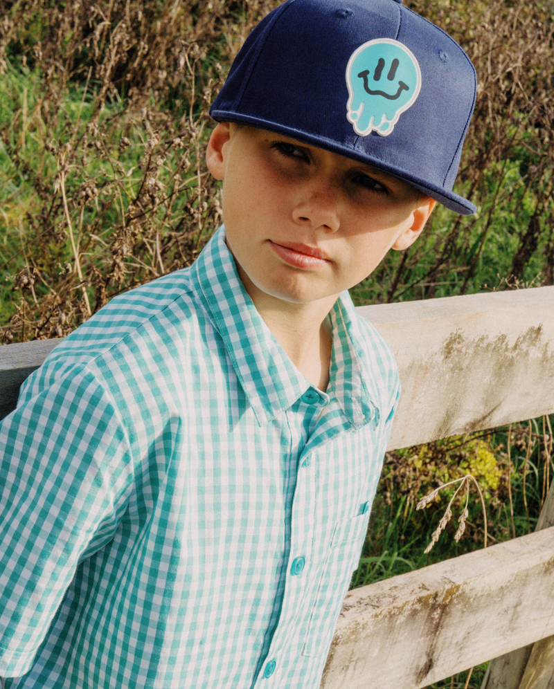 THE COLLECTIBLES | Navy Drippin in Smiles Flat Peak Cap