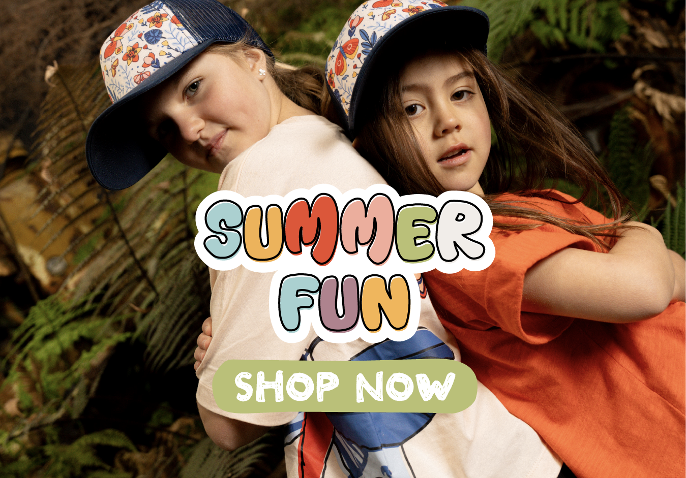 Two girls wearing hats and tees from the Summer Fun collection from The Girl Club Spring Summer 25 SS25 collection.